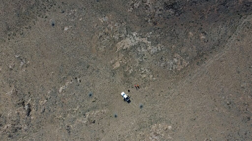 Drone aerial view of the team and vehicle